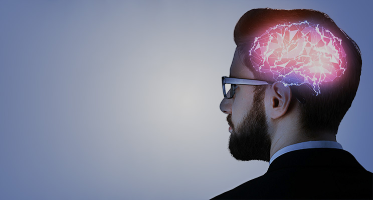 man with highlighted xray of brain